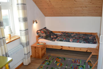 Gruenes Ferienhaus Schlafzimmer